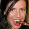What a great smile from a lovely cigar smoking gal.